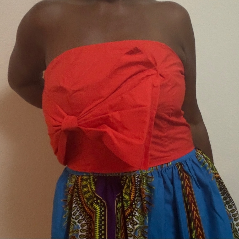 Orange tube top with large bow.